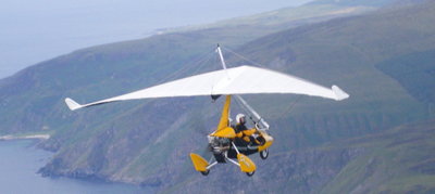 Weightshift microlight flying along the Scottish coast